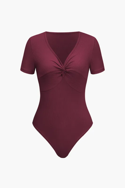 Solid snoet knude ribbed bodysuit sold by Micas