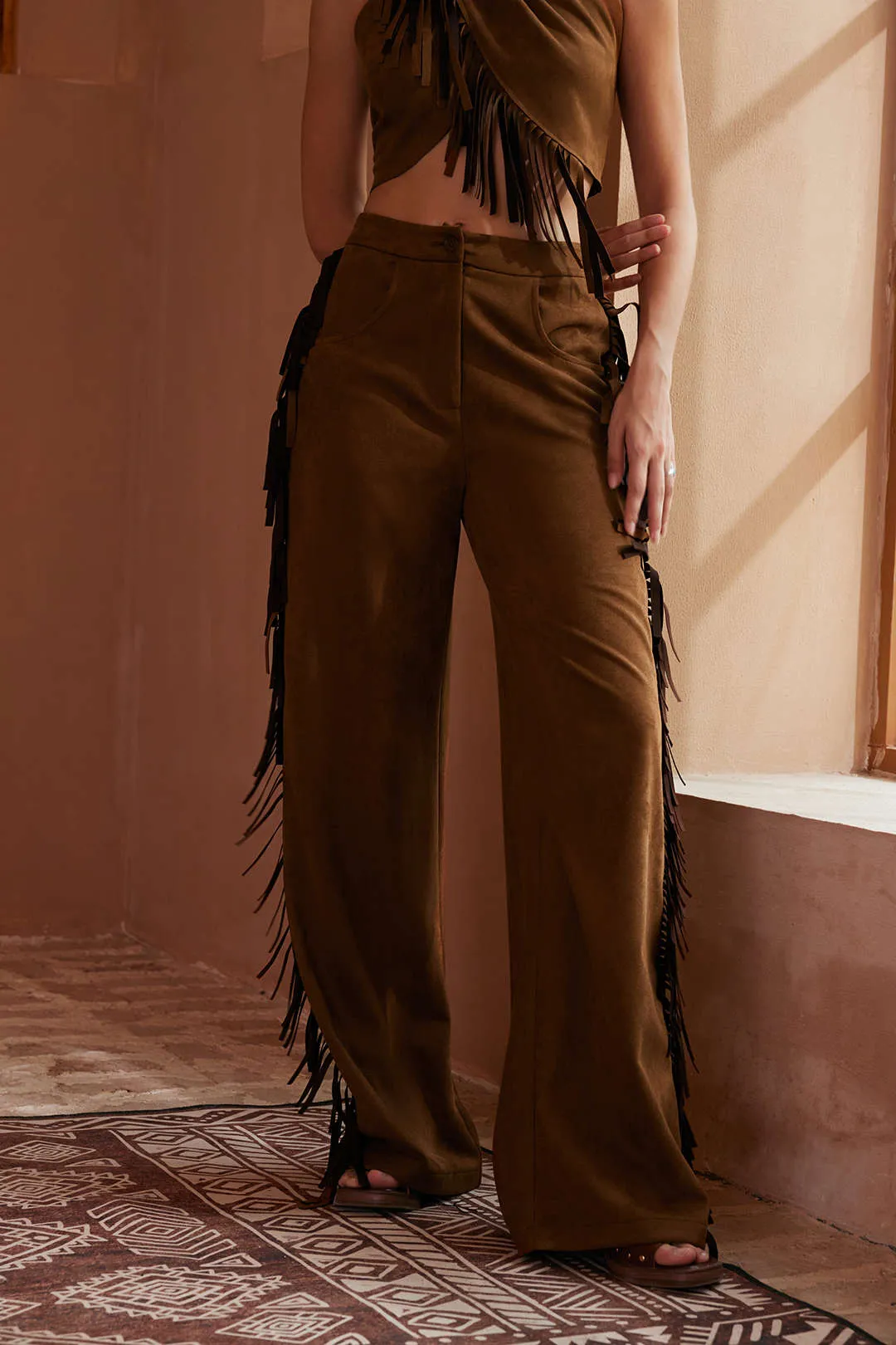 Solide frynser bukser sold by Micas