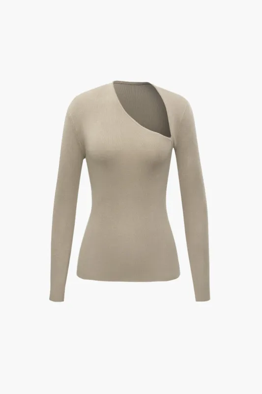 Solid strik asymmetrisk langærmet top sold by Micas