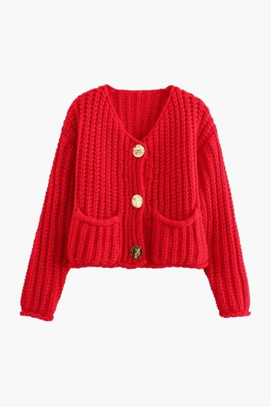 Strik cardigan med knaplomme sold by Micas