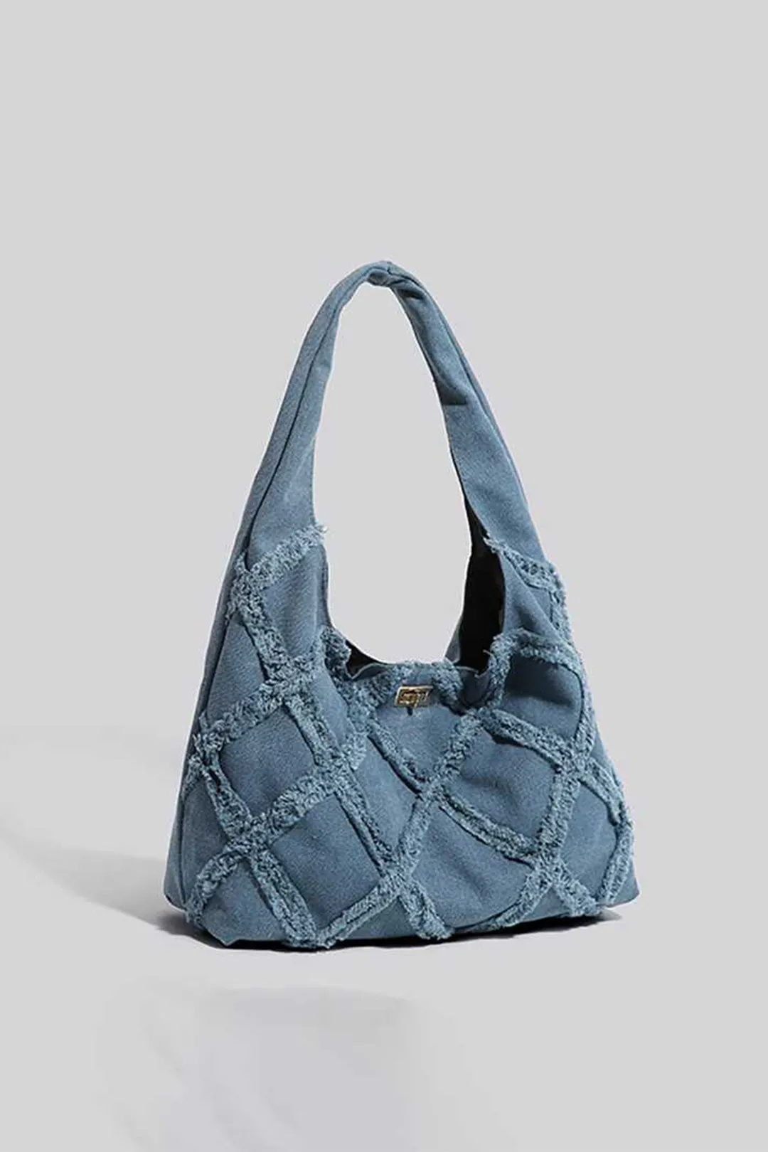 Frayed Denim Patchwork Shoulder Bag sold by Micas