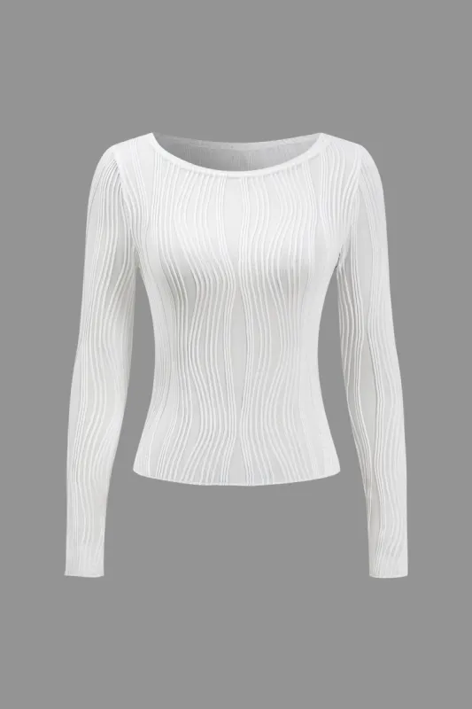 Solid langærmet top sold by Micas