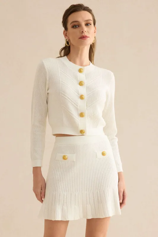 Strik metallisk rundhalset langærmet top sold by Micas