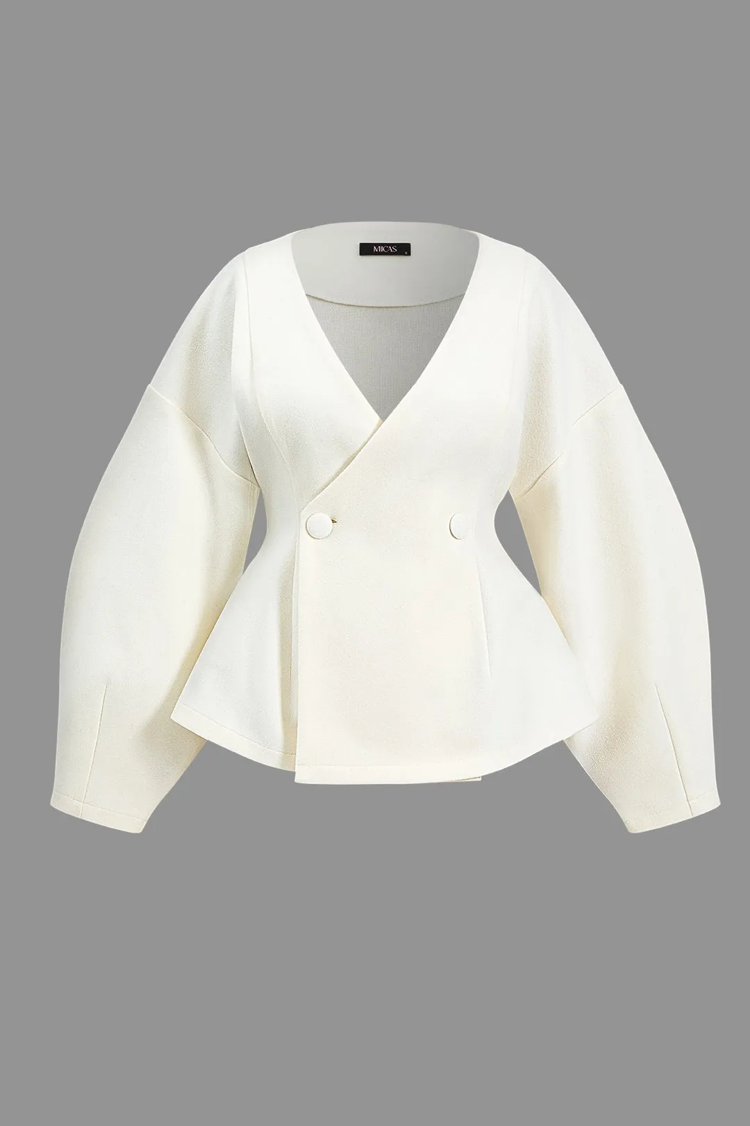 Solid knapfrakke sold by Micas