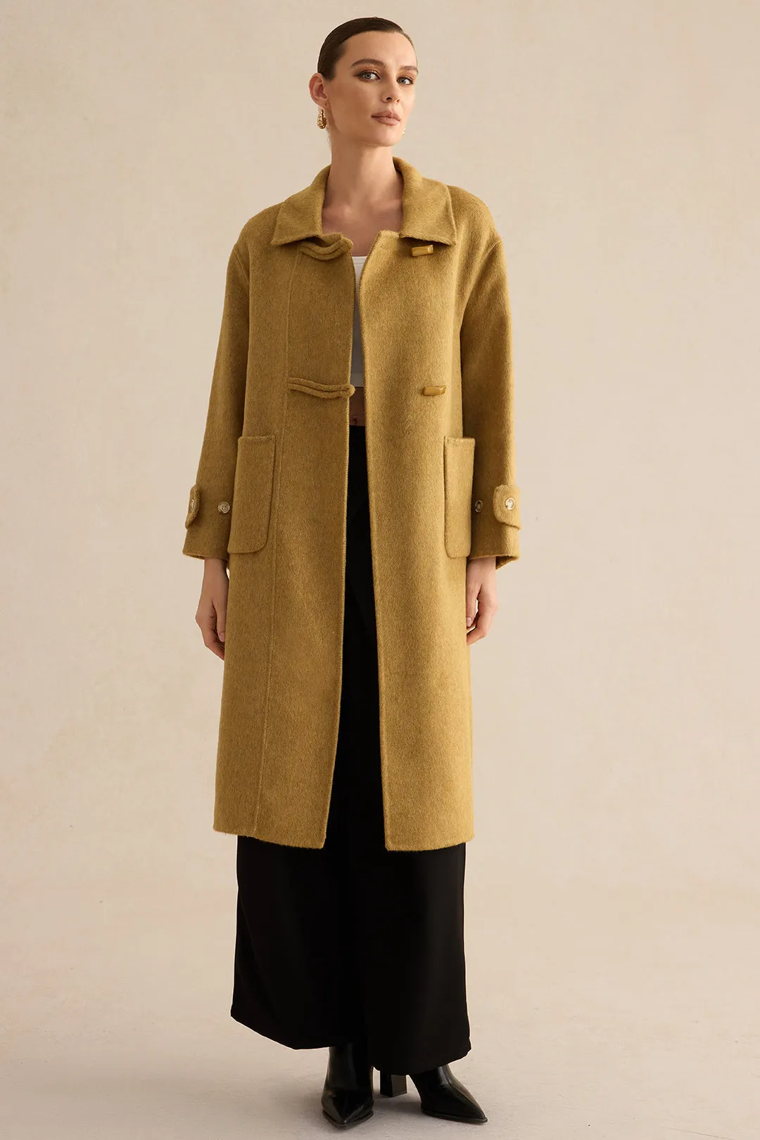 Uld frakke sold by Micas