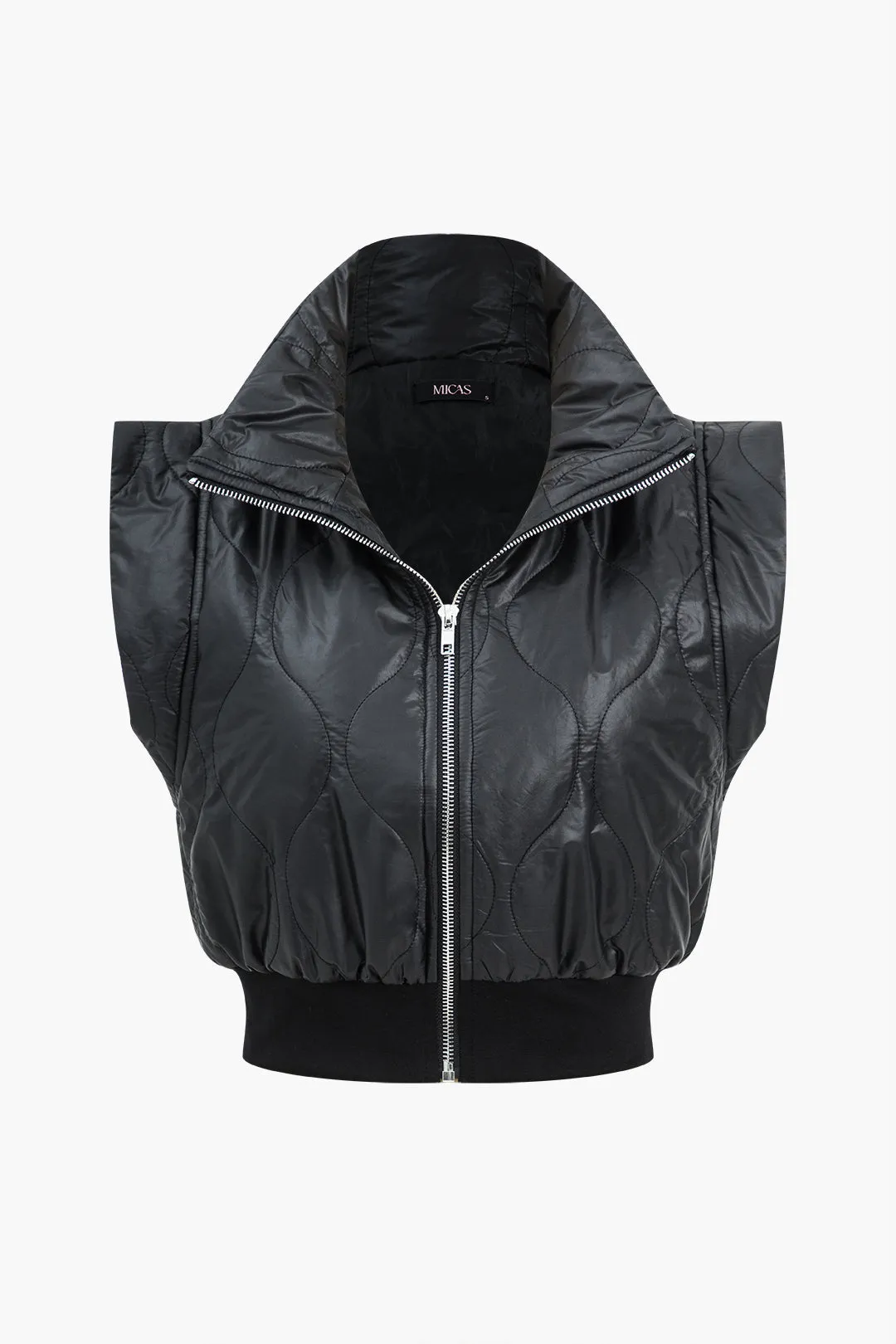 Polstrede lynlåspuffere sold by Micas