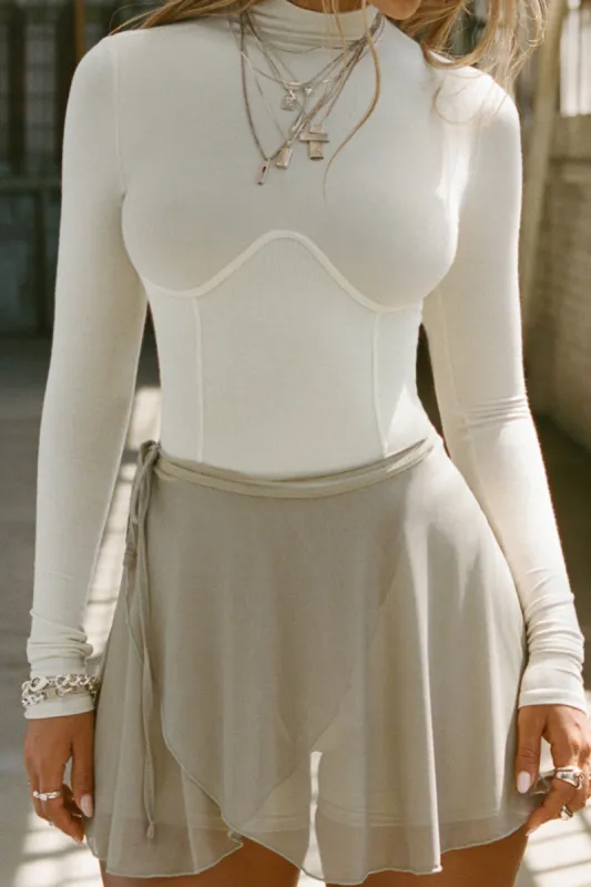 Solid bustier langærmet top sold by Micas