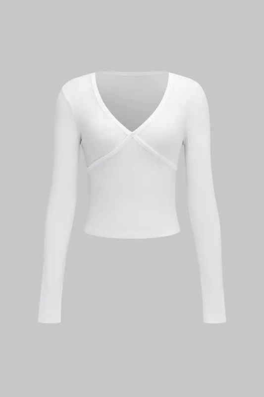 V-hals krydsdesign langærmet top sold by Micas