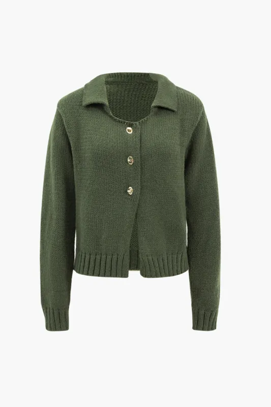 Strikket metallisk knap langærmet top sold by Micas