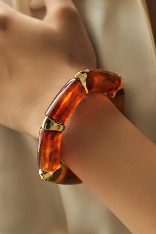 Amber og metalarmbånd sold by Micas