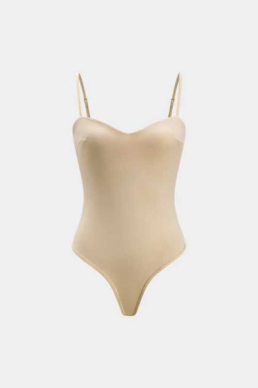 Solid slip bodysuit sold by Micas