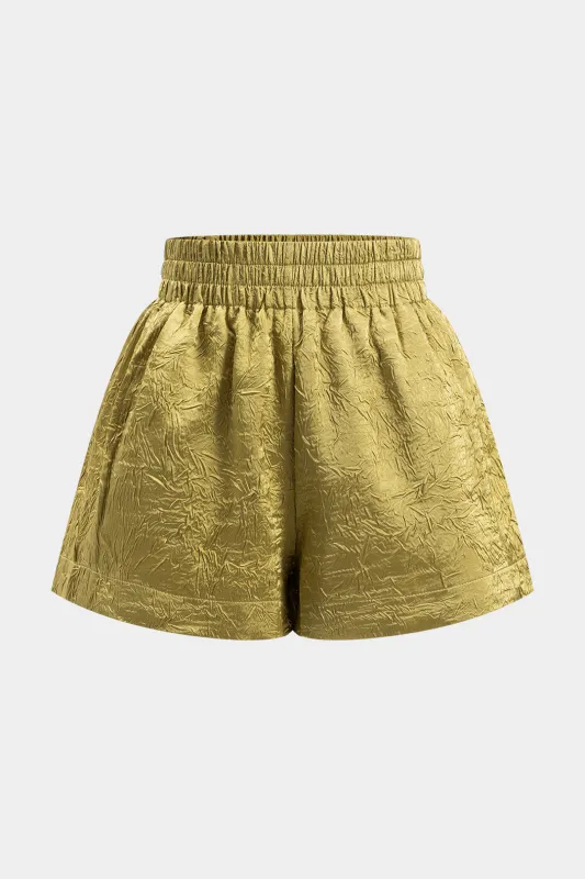 Solid teksturerede plisserede shorts sold by Micas