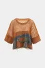Denim hul ud patchwork tank top sold by Micas