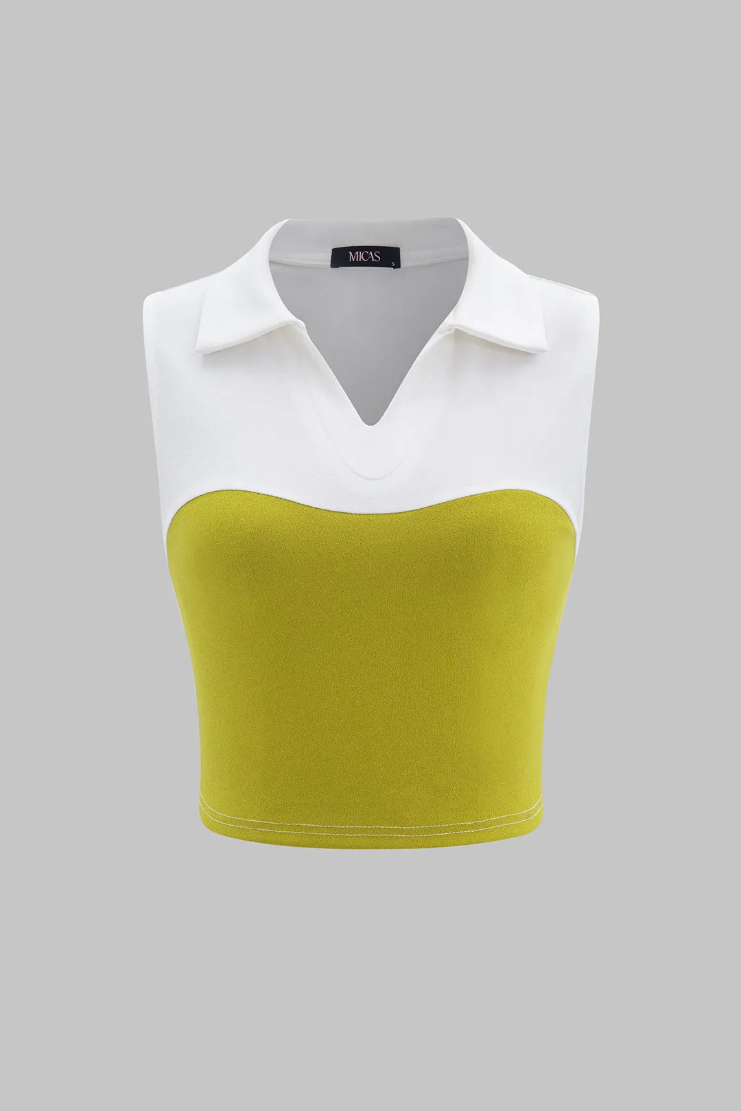 V-hals patchwork tank top sold by Micas
