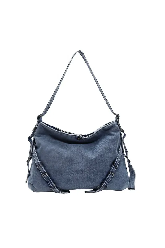 Vasket denim tværkropspose sold by Micas