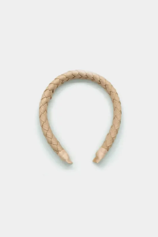 Faux læder vævet pandebånd sold by Micas