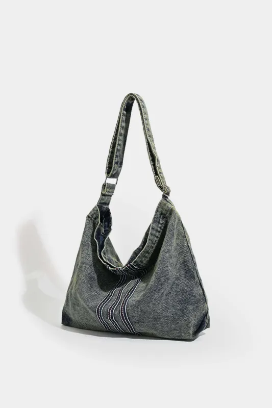 Vasket denim lynlås tværkropspose sold by Micas