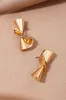 Twisted Metallic Surface Earring sold by Micas