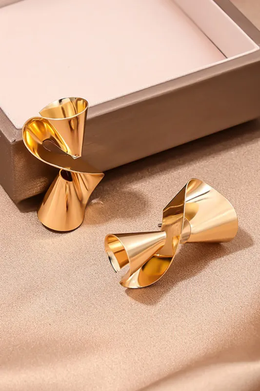 Twisted Metallic Surface Earring sold by Micas