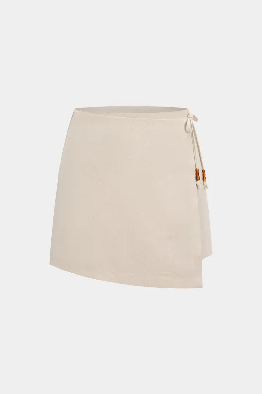 Solid Asymmetrical Beaded High Waist Skort sold by Micas