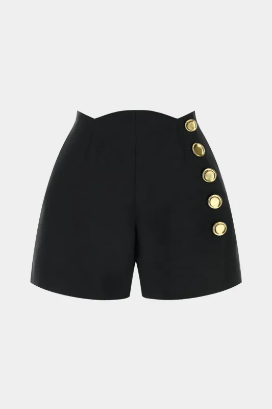 Asymmetrical Metallic Button Shorts sold by Micas