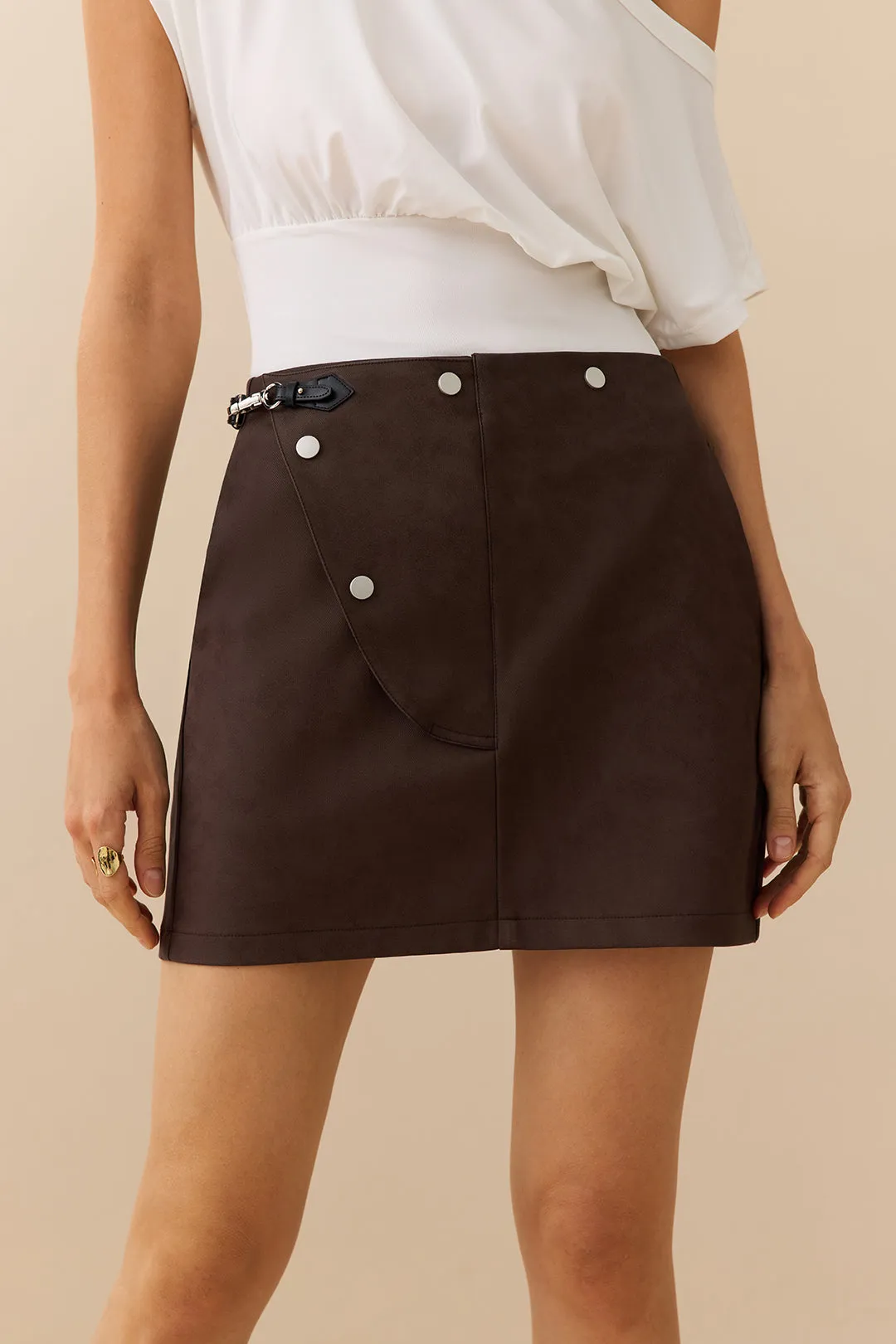 Faux Leather Asymmetrical Button Belted Skirt sold by Micas