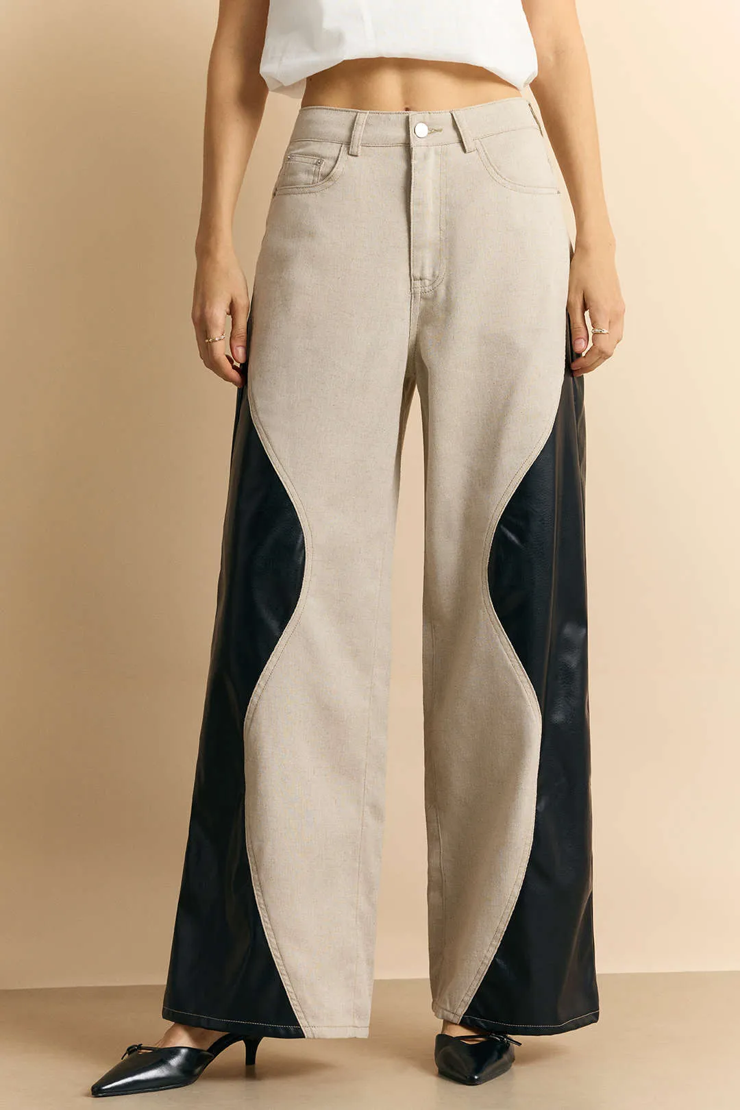Faux Leather Button Patchwork Trousers sold by Micas