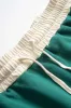 Contrast Binding Long-Sleeve Top And Drawstring Skirt Set sold by Micas