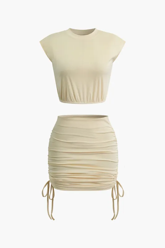 Solid Round Neck Ruched Sleeveless Top And Tie-Up Skirt Set sold by Micas