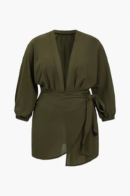 Plus Size Ruched Asymmetrical Knotted Long Sleeve Mini Dress made by Micas