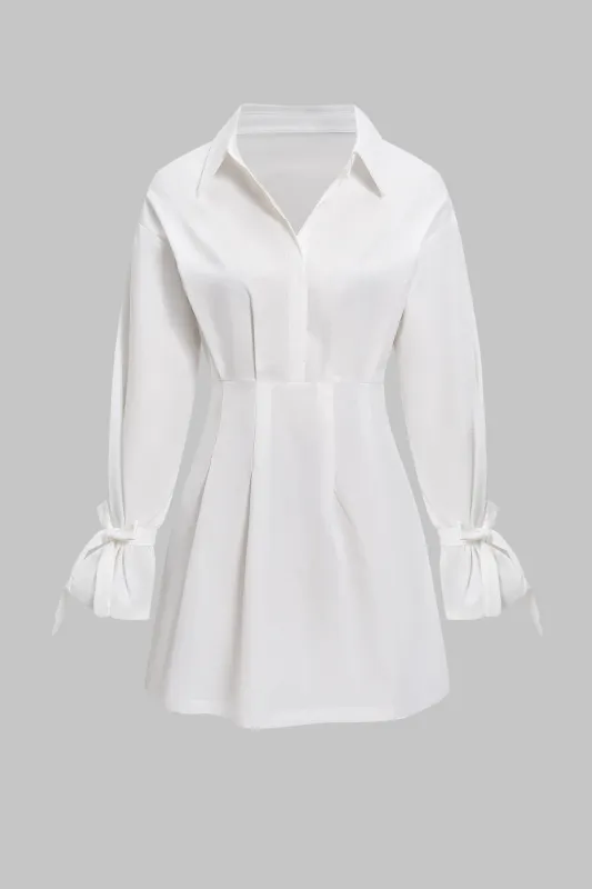 Button Pleated Bow Long Sleeve Mini Dress sold by Micas