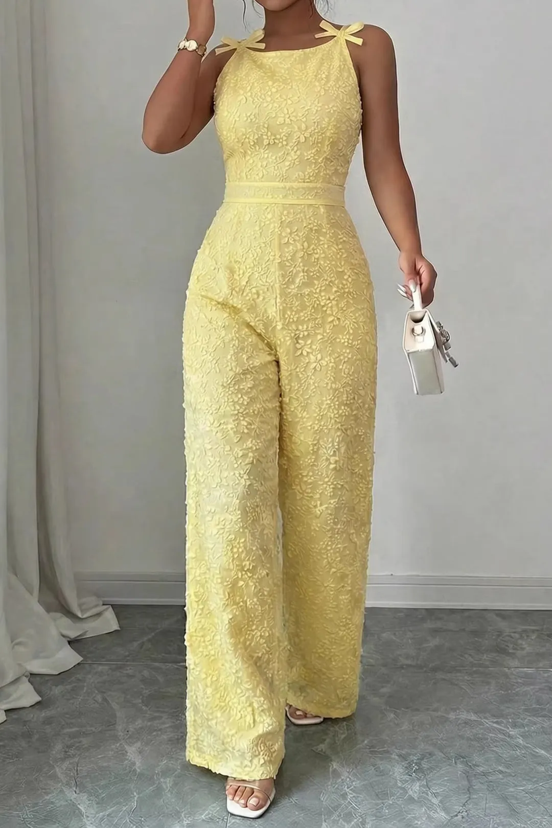 Foral Textured Round Neck Bow Sleeveless Jumpsuit sold by Micas product image thumbnail 2