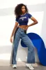 Kontrast jeans med brede ben sold by Micas