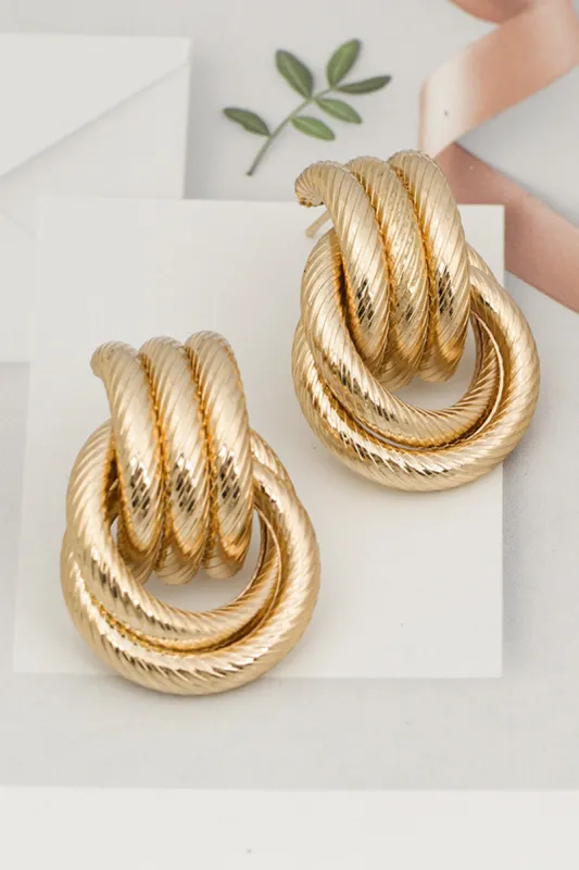 Metal overdrevne øreringe sold by Micas