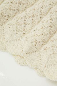 Openwork Knit Ruffle Mini Skirt sold by Micas