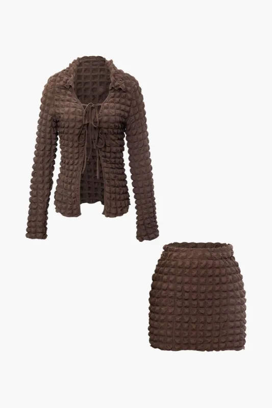 Popcorn Textured V-neck Collar Tie Front Top And Mini Skirt Set sold by Micas