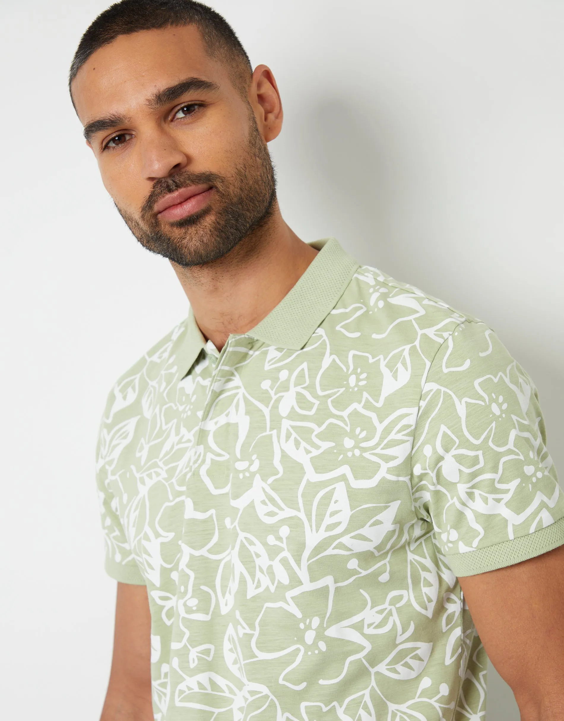 Men's Sage Floral Print Hidden Placket Polo Shirt sold by Threadbare
