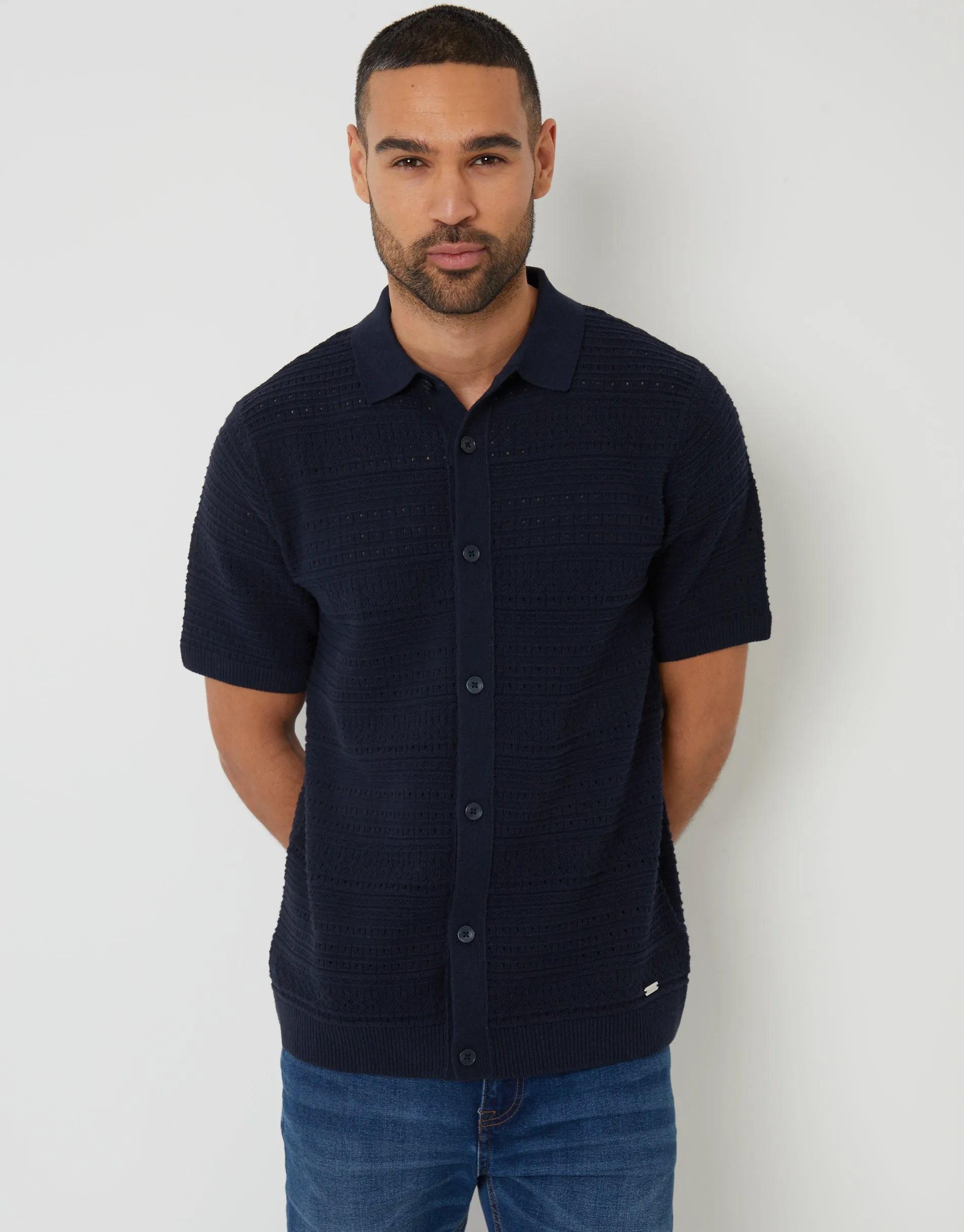 Navy Textured Knitted Button Through Polo Shirt sold by Threadbare