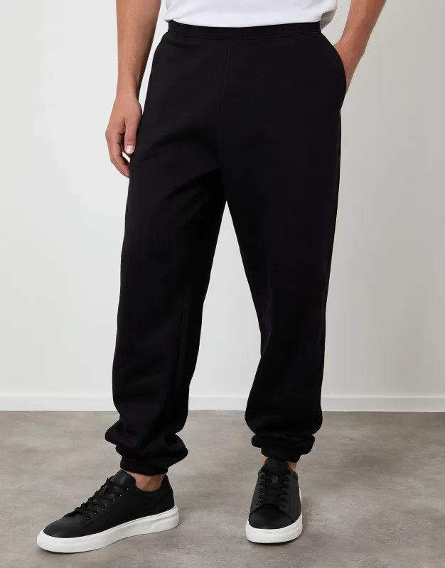 Black Relaxed Fit Cuffed Joggers sold by Threadbare