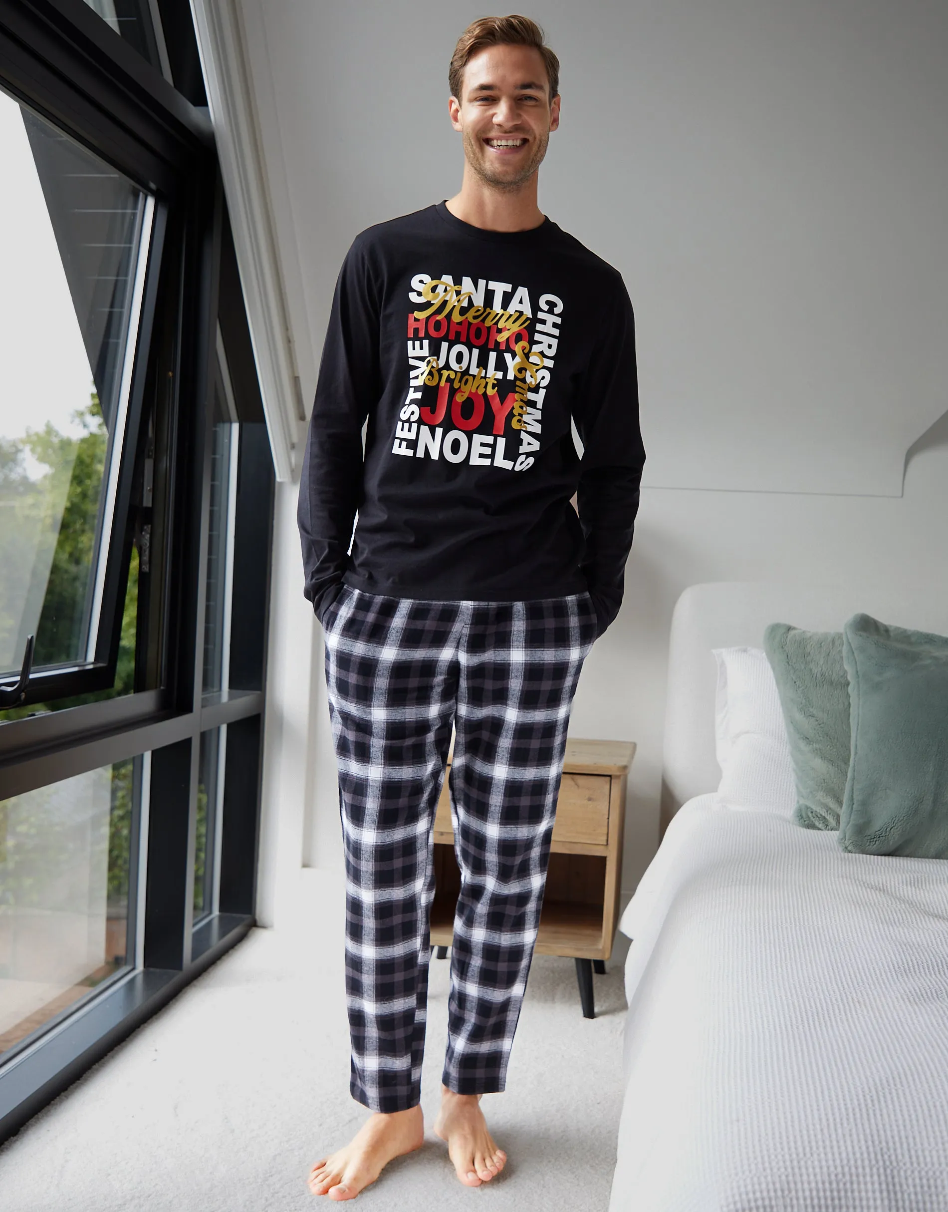 Black Christmas Slogan Graphic Long Pyjamas (2-Piece Set) sold by Threadbare