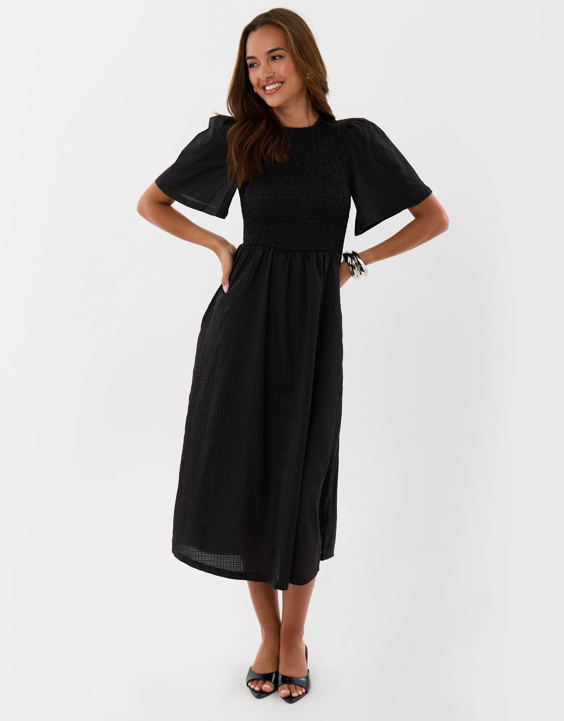 Puff Sleeved Shirred Dress in Black sold by Threadbare