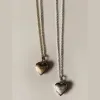 Lover Locket sold by Raquel Rosalie