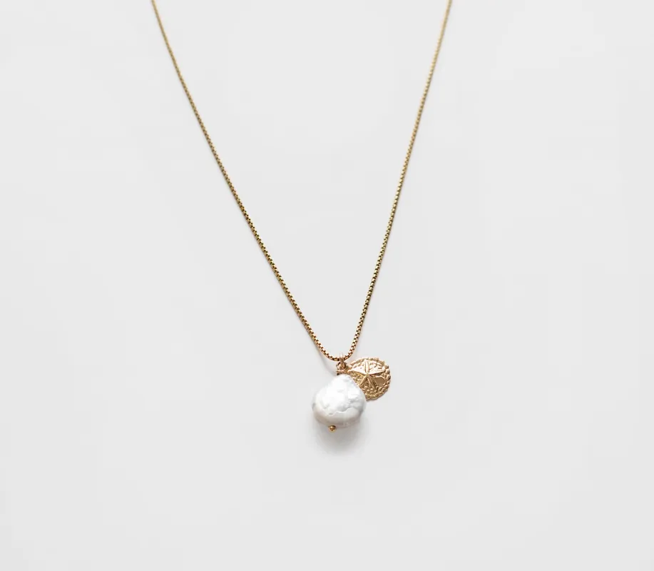 Sand Dollar Necklace sold by Raquel Rosalie