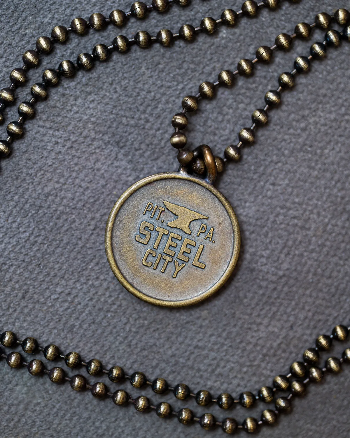 Anvil Necklace sold by Steel City