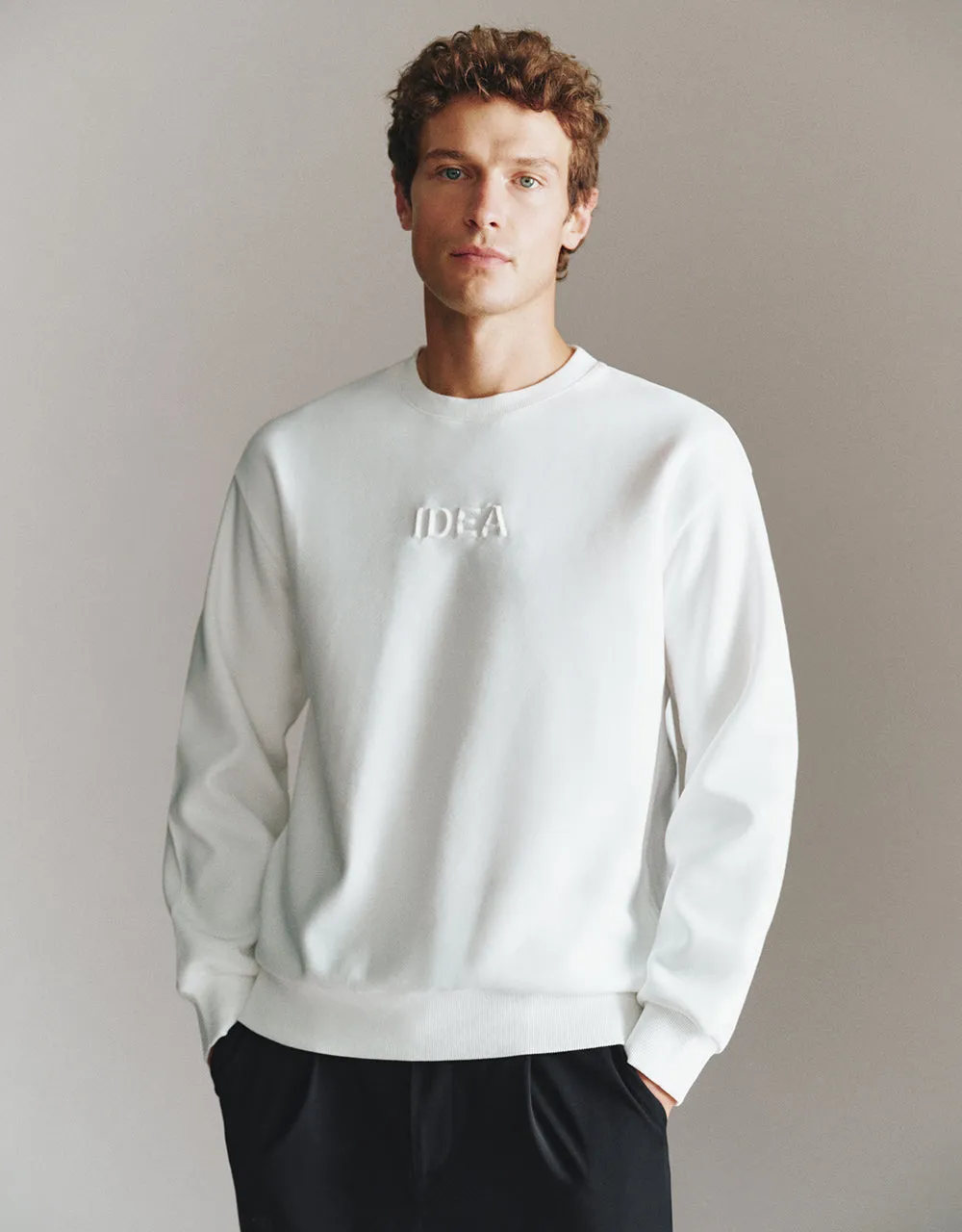 Letter Embossed Crew Neck Sweatshirt sold by Urban Revivo
