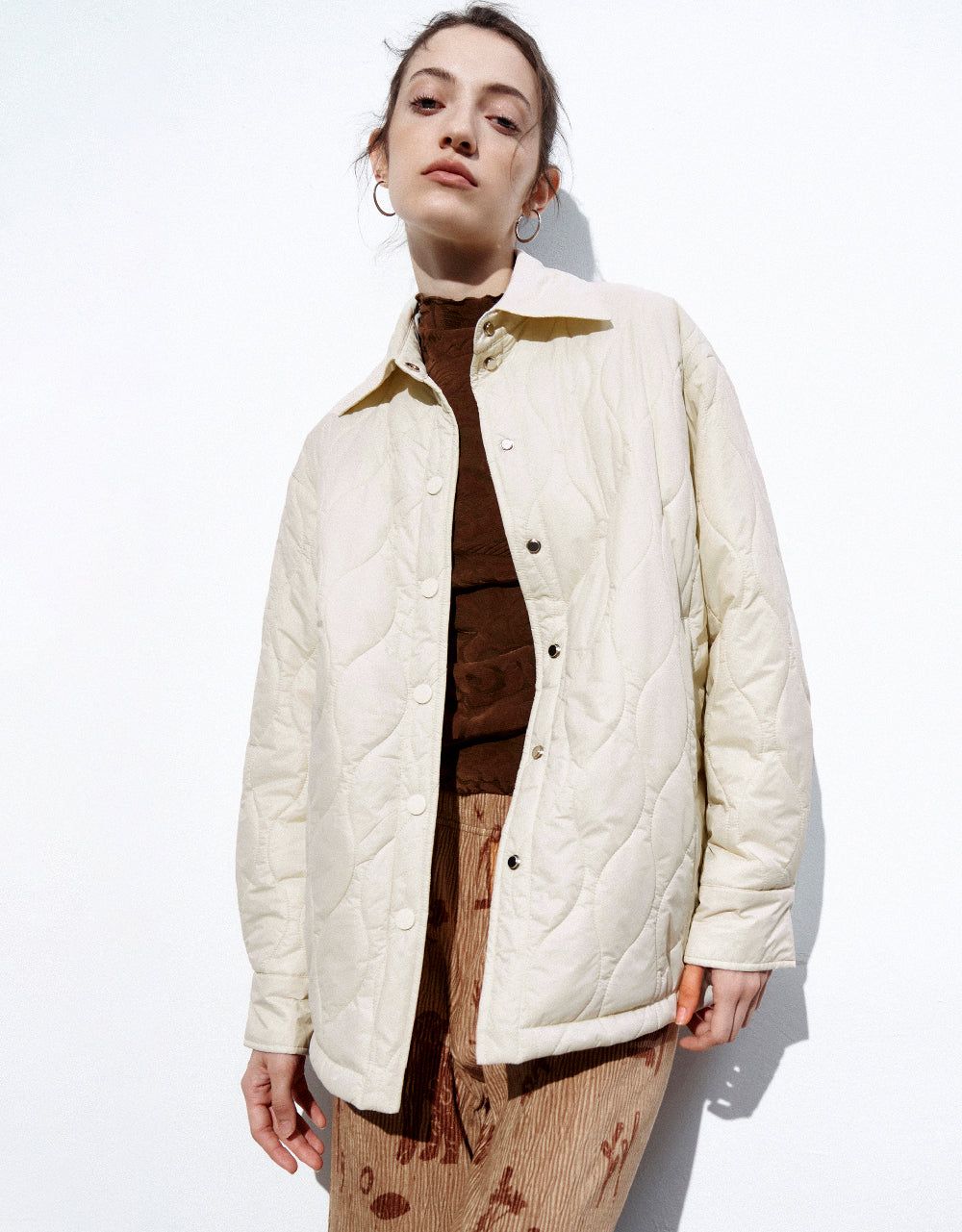 Presed Button Embossed Padded Coat sold by Urban Revivo