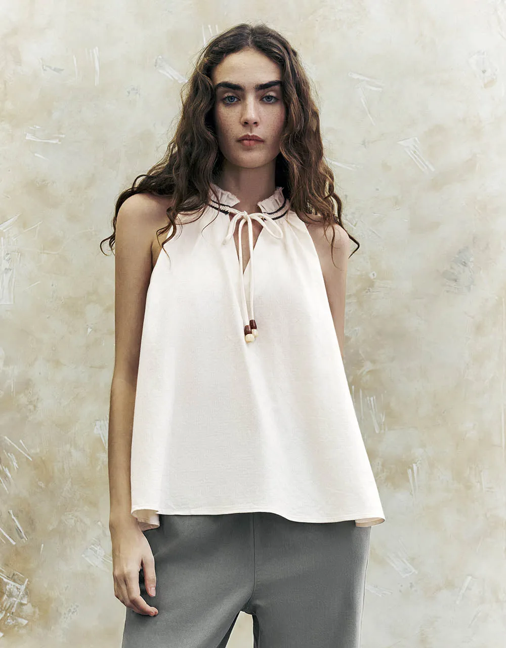Sleeveless Tie Front Overhead Shirt sold by Urban Revivo