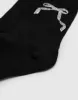 Bow Tie Mid-Length Socks sold by Urban Revivo