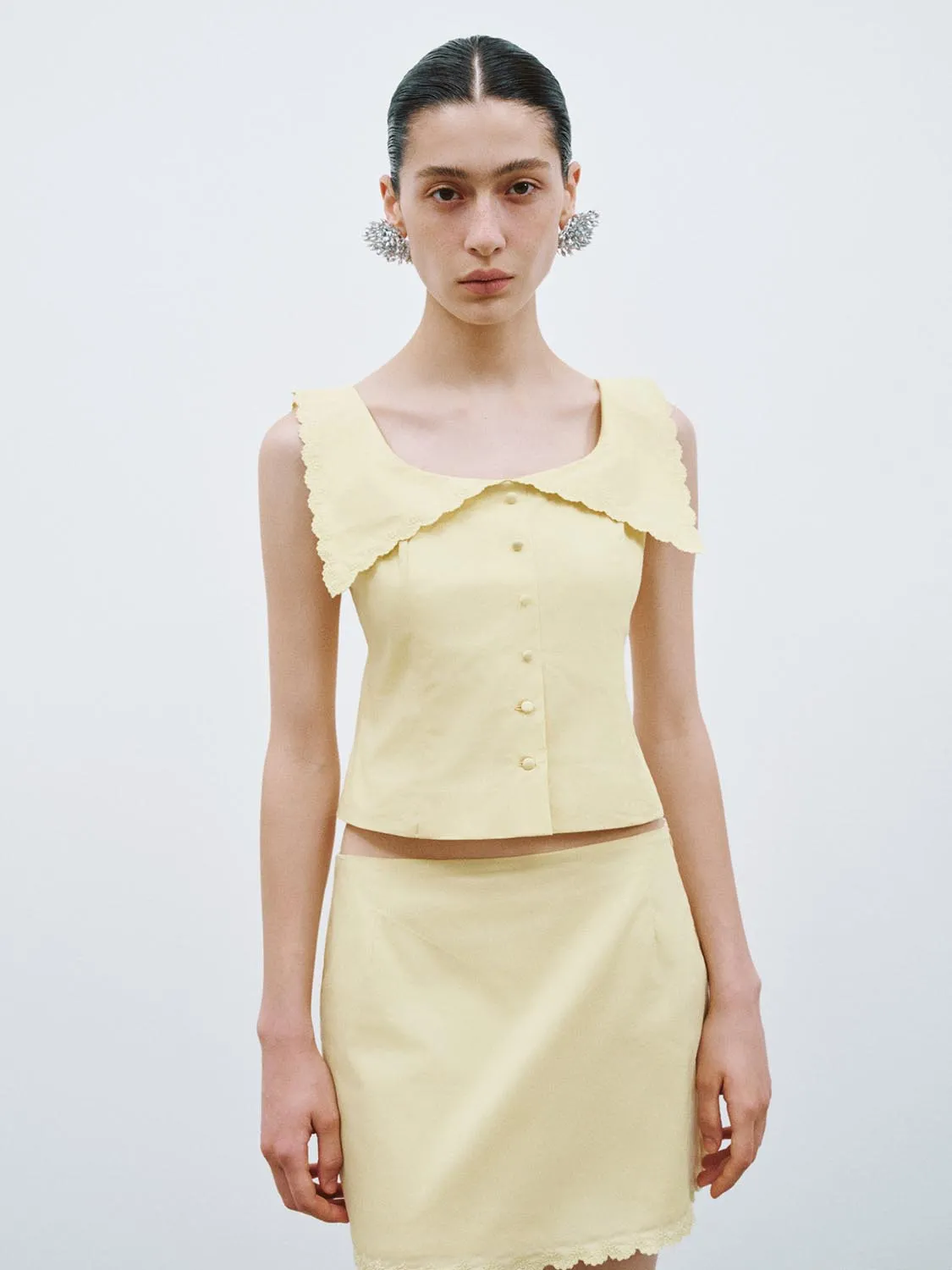 Frill Lapel Sleeveless Tops sold by Urban Revivo