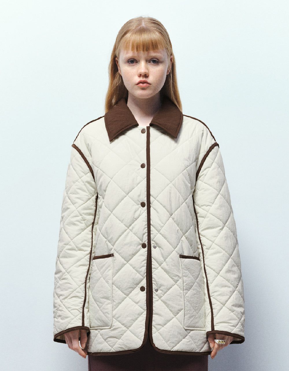 Presed Button Embossed Padded Coat sold by Urban Revivo